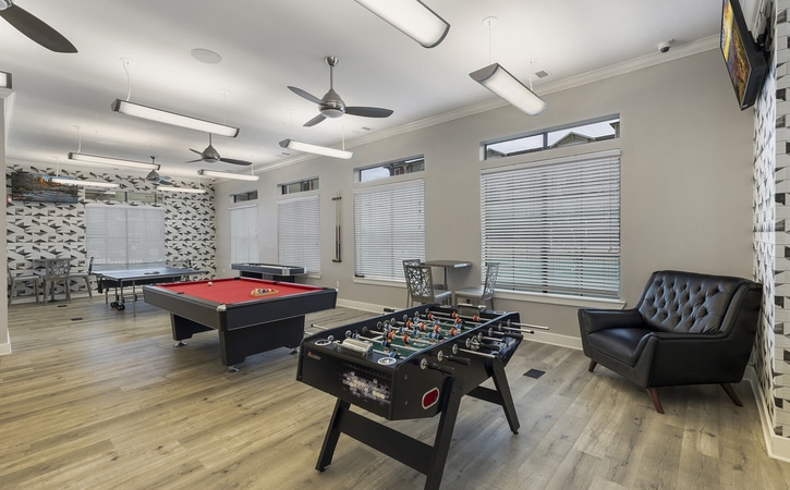arba san marcos off campus apartments near texas state university resident clubhouse game room foosball and billiard tables